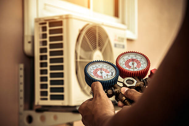 Professional Air Conditioning Service technician working in Calera, AL